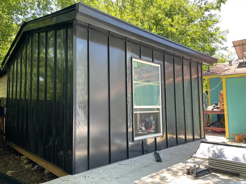 Black standing seam metal wall panels for Roof Inspection in Yoakum